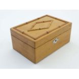 A 19thC whitewood box with faux bamboo decoration to top.