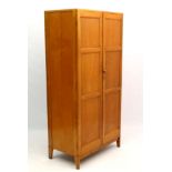 Arts and Crafts : a mid century Cotswold School blond oak 2 door wardrobe ,