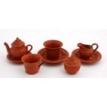 A Continental 19thC pate de terre style Chinese child's tea set comprising 2 cans and saucers,