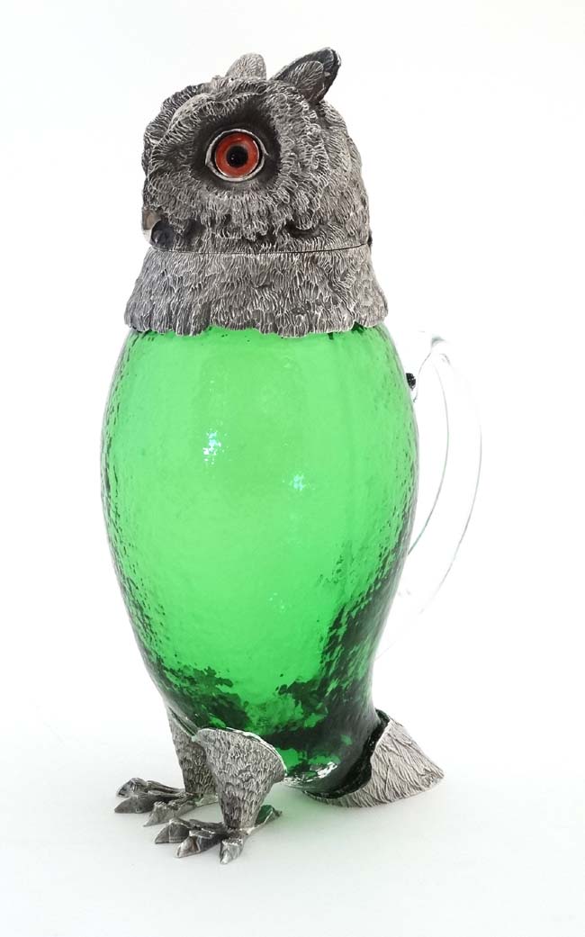 A late 20thC silver plate and green glass novelty claret jug in the form of an owl with glass eyes. - Image 7 of 7