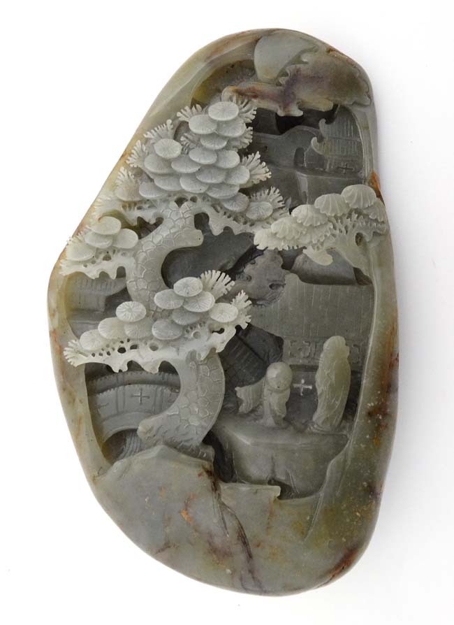A large jade carving depicting figure of a sage and scholar with temples amongst spruce trees. - Image 3 of 3