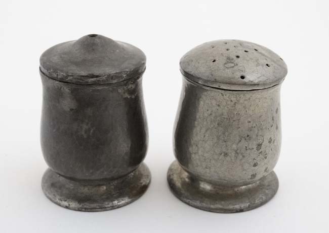 Liberty : An Arts and Crafts plannished pewter comprising salt and pepper and numbered 1078 under.