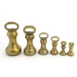 A set of 6 assorted graduated brass chess weights from 7lb - 8oz The smallest 3" high