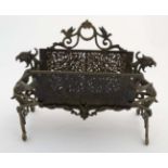 A late Victorian cast brass letter rack with birds and hawks head decoration.