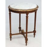 A 19thC Continental circular table with carerea marble to top gilt four legged table 24" diameter