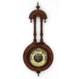 Aneroid Barometer : an early 20 th C walnut cased wall barometer with open visible workings ,