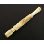 An early 20thC carved bone cigarette holder 3 1/2" long CONDITION: Please Note -