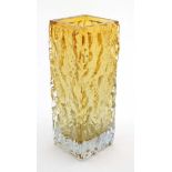 A Whitefriars style golden amber coloured glass textured bark vase of square form .