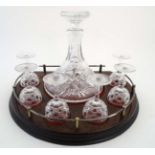 A lead crystal Ship's decanter together with 6 pedestal crystal drinking glass ,