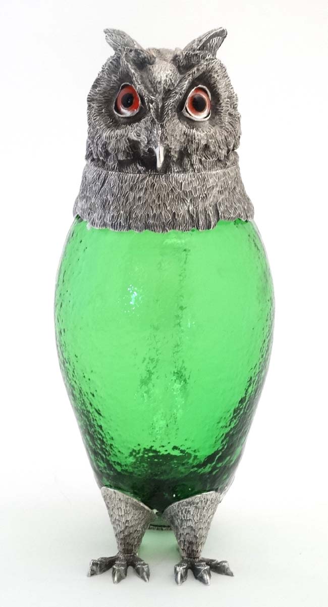 A late 20thC silver plate and green glass novelty claret jug in the form of an owl with glass eyes. - Image 4 of 7