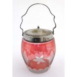 An early 20thC glass biscuit barrel with silver plated mounts lid and handle,