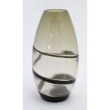 A late 20thC art glass vase of smokey glass with black glass swirl.