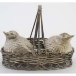 A 20thC silver plate novelty cruet set, the salt and pepper formed as birds,