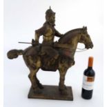 An early - mid 20thC Chinese gilded figure of Guang Gong warrior on horseback.