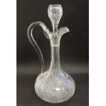 A late 19thC / early 20thC jug formed decanter and stopper with loop handle .