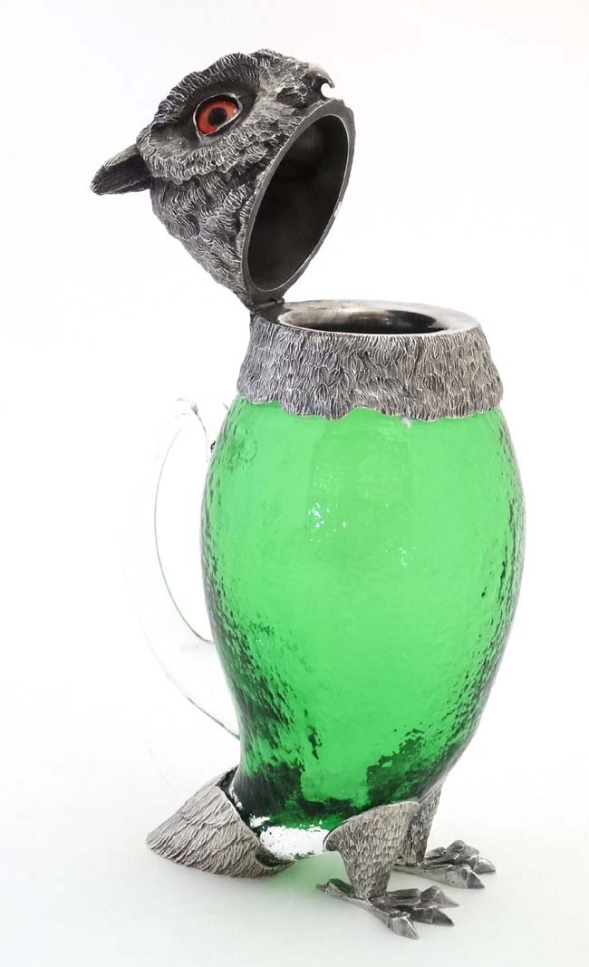 A late 20thC silver plate and green glass novelty claret jug in the form of an owl with glass eyes. - Image 5 of 7