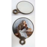 An early - mid 20thC bevelled hand mirror with image to back of a monk drinking ale.