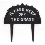 A 21stC painted cast metal 'Keep off the grass' sign with spike to base CONDITION: