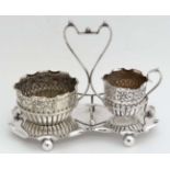 A silver plated strawberry set comprising cream jug and sugar basin