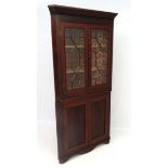 A 19thC mahogany floor standing 13 panel glazed top corner cupboard 81 1/2" high