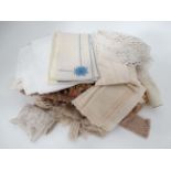 A quantity of assorted table linen lace etc.