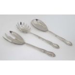 A pair of silver plated salad servers together with a serving spoon the longest 10 3/4" long