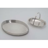 A silver plated oval tray with galleried side together with a cake basket with swing over handle.