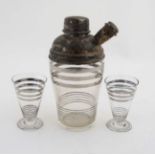 Art Deco cocktail set comprising a glass cocktail shaker with silver plate top and 2 conical