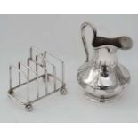 A silver plate toast rack together with an Elkington & Co silver plate cream jug (2)