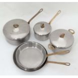 Cooking : five graduated pans with brass handles and stainless steel bodies to include 2 frying