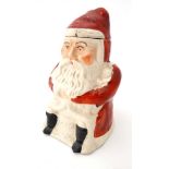 An English Majolica style tobacco jar formed as Father Christmas / Santa Claus,