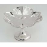 A silver plated pedestal dish with frettwork decoration CONDITION: Please Note - we