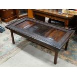 Glass topped coffee table formed from a carved oak panel CONDITION: Please Note -