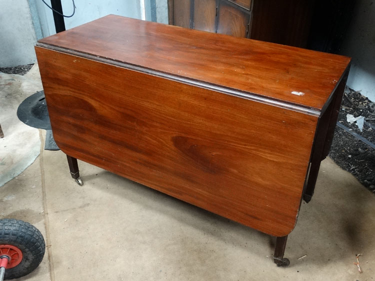 An 18thC mahogany drop flap table with four legs ( 2 gate legs) 44" wide,