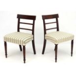 A pair of Geo V mahogany over stuffed dining chairs 32 3/4" wide CONDITION: Please