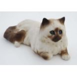 A Winstanley colour point Persian cat in size 7, with glass eyes, bears makers signature to base.