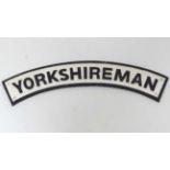 A 21stC cast metal curved sign 'Yorkshireman',