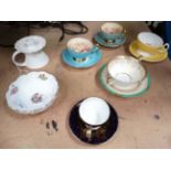 Assorted Aynsley china items to include candle holder and various cups and saucers, sugar bowl.