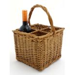 A wicker 4- bottle basket with loop handle approx 13 1/2" high CONDITION: Please