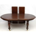 A late 20thC Victorian style mahogany D-ended wind out dining table, 80" long,