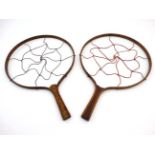 An unusual matched pair of 19thC gaming rackets of bent wood construction with cone shaped studs to