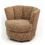 Art Deco : An Octagonal shaped raised back sprung seated upholstered Tub chair with foliate and