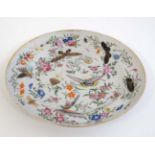 An 18thC famille rose Oriental style plate.