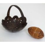 A carved Coquilla nut pomander and coconut shell basket (2) CONDITION: Please Note -