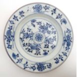 An 18th / 19thC Chinese blue and white plate painted with flowers within a floral boarder ,