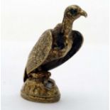 A 19thC gilt metal hand seal formed as a vulture with seal under engraved with D? within a belt.