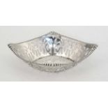 A silver bon bon dish with openwork decoration and beaded rim. Hallmarked Birmingham 1909 maker W.H.