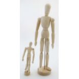 An Artists wooden lay figure / mannequin together with a smaller version.