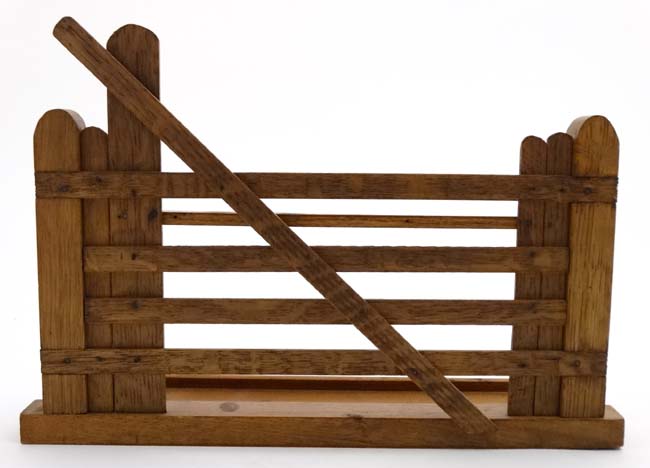 An early 20thC novelty pipe rack of 6 divisions formed as a gate 12" wide x 3" deep x 8" high - Image 4 of 5