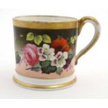 A 19thC English hand painted cup with polychrome floral decoration and gilt borders. 3'' high.